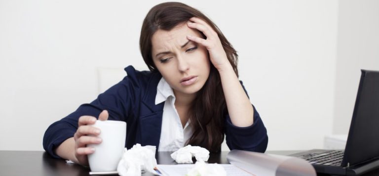 woman at work not feeling well